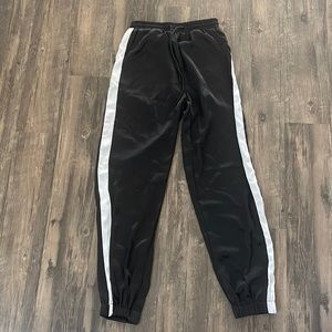 Black silk joggers with white stripe